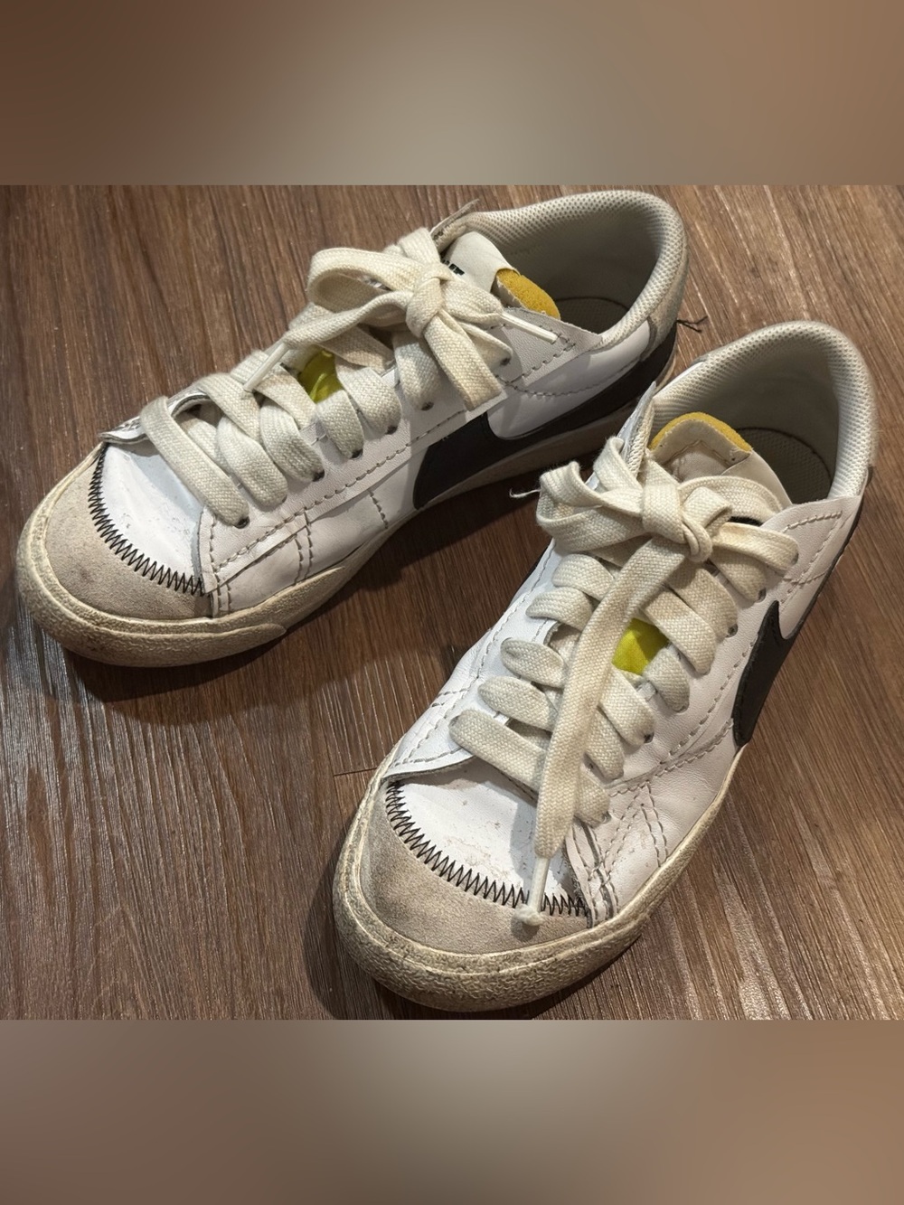 Nike White Blazer Sneakers with Black Swoosh and Yellow Tongue Accents